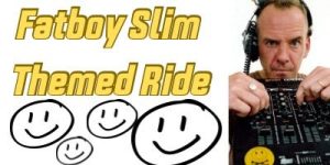“Fatboy Slim-themed indoor spin class at LuvFitnessStudios with cyclists riding to upbeat music led by instructor Nicole”